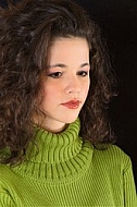 Young girl portrait with green pullover