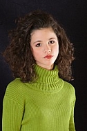 Young girl portrait with green pullover