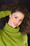 Young girl portrait with green pullover