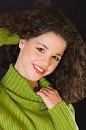 Young girl portrait with green pullover