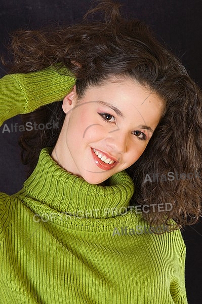 Young girl portrait with green pullover