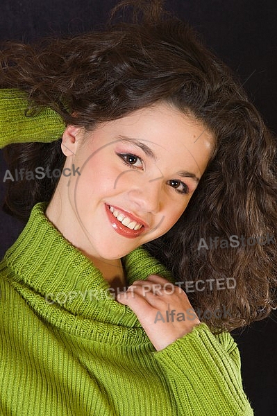 Young girl portrait with green pullover