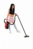 Yung girl with vacuum cleaner. White background