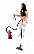 Yung girl with vacuum cleaner. White background