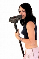 Yung girl with vacuum cleaner. White background