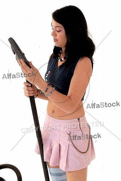 Yung girl with vacuum cleaner. White background