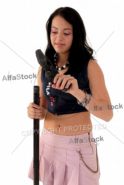 Yung girl with vacuum cleaner. White background