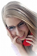 Blonde girl with glasses and red phone