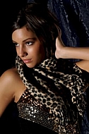 Girl with brown hair and leopard patterned clothes