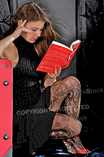Girl with brown hair reading book