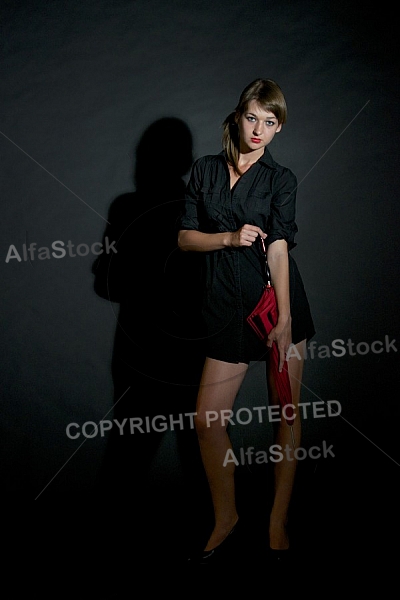 Modell girl posing with red umbrella