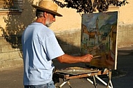 Old man painting on the street