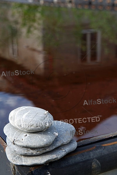 Stones with the reflection of a house