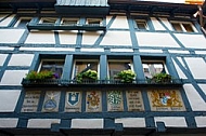 Windows of a house with old paintings