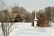 Winter landscape with a cross
