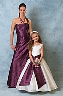 Woman and girl in purple and white Dresses