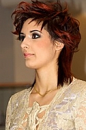 Woman with styled hair in a site dress