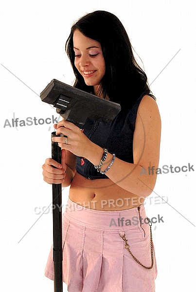 Yung girl with vacuum cleaner. White background